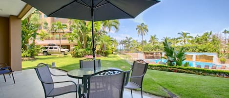 Large private patio overlooking pool, lush gardens