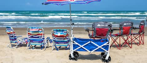 6 beach chairs, umbrella and beach wagon provided