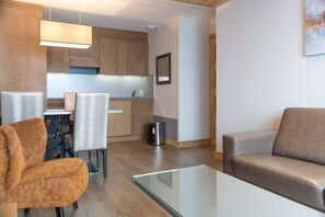 Prepare meals in the kitchenette and enjoy them at the dining table.