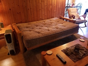 Futon couch folds out to a size Full bed.