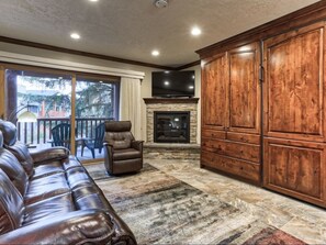 View of custom fireplace and walk-out balcony.