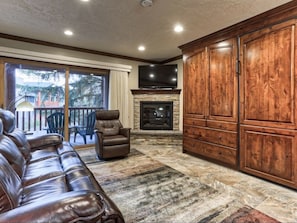 View of custom fireplace and walk-out balcony.