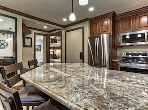 Custom, quartzite peninsula is a comfortable gathering place.