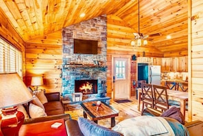 Living room with stone fireplace 