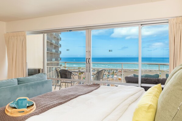 Experience serene ocean views from the comfort of your bed