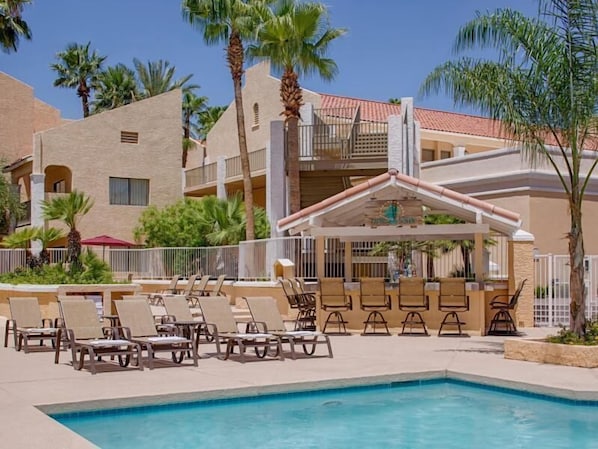 Large heated swimming pool, poolside loungers and picnic tables