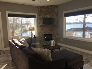 Living room with fireplace and large picture windows to enjoy the view