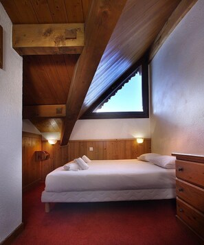 The master bedroom features a cozy Double bed.