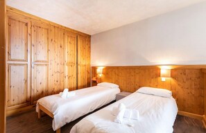 The two bedrooms each feature 2 Single beds.