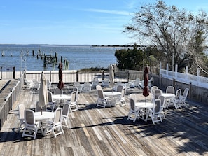 Enjoy a lovely lunch or glass of wine by the water on the deck