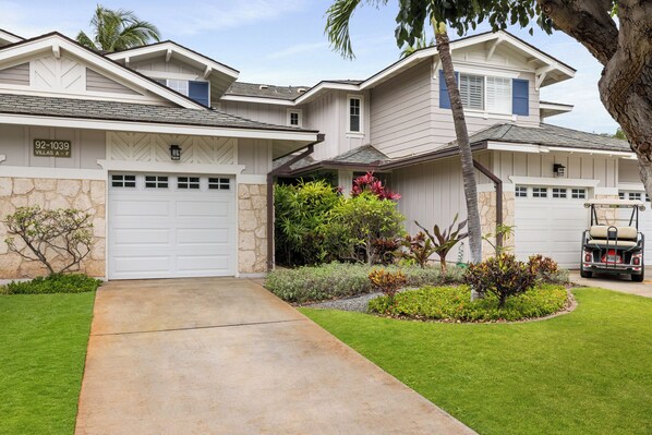Long drive with entrance to right shows single garage