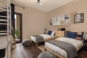 Bedroom 1 comes with two twin beds