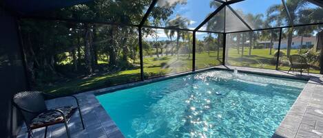 Salt water heated pool set in private backyard. 