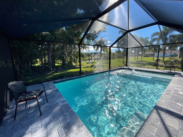 Salt water heated pool set in private backyard. 