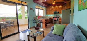 Comfy Living area and kitchen with views of the jungle and ocean in the distance