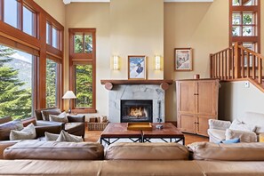 Open plan living, kitchen, and dining spaces