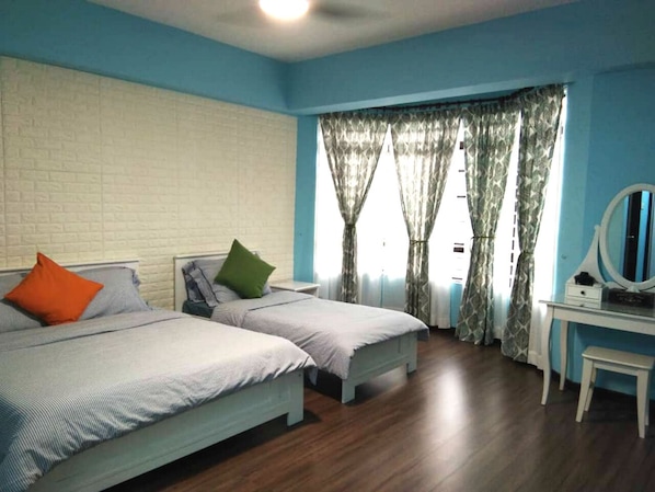 Master bedroom with 1 queen bed, 1 single bed and dressing table