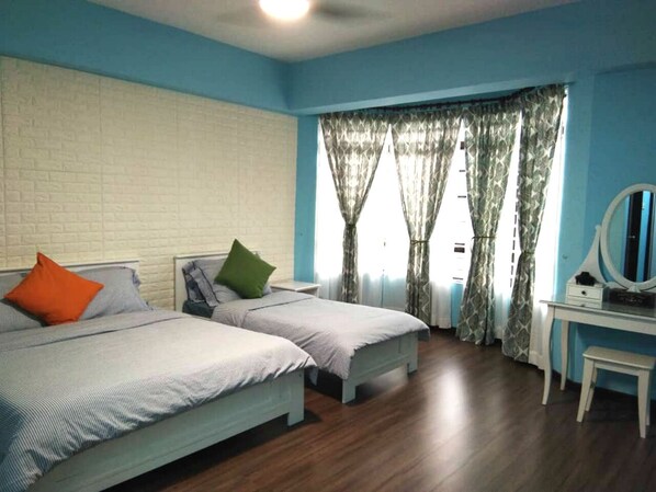 Master bedroom with 1 queen bed, 1 single bed and dressing table