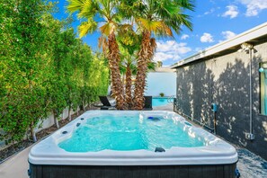 Hot tub nestled under the palms
