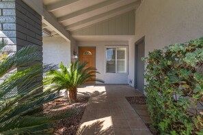 Sidewalk leading to front door. 