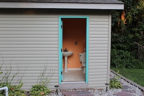 Outdoor bathroom for convenience.