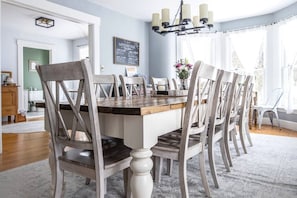 Dreamy custom farmhouse dining room table with 10 seats additional chairs and small tables available as well