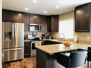 Kitchen with all new Cooking Utensils, Waffle Maker, Coffee Pot, Fresh Fruit!