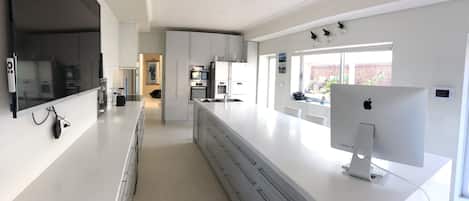 Large Modern Kitchen and outlook to AlFresca area