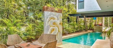 The pool has shading from the upper level to keep temps cool and refreshing