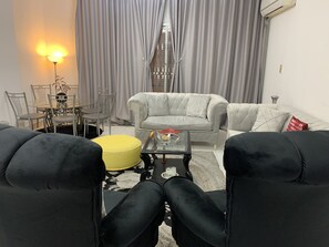 Spacious living room with air conditioner