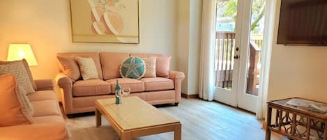 New Sunbrella Living Room Furniture and
   Hardwood Plank Flooring throughout