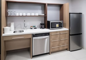 Convenient kitchenette includes dishwasher, microwave fridge and sink!