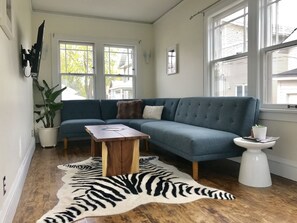 Sun room with TV gives extra space for larger groups