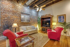 The photo shows the living room, complete with a TV area equipped with Fire TV and Netflix. 