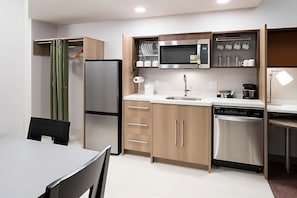 Updated kitchenette includes fridge, freezer, dishwasher, microwave and coffeemaker