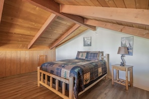 Upstairs living room loft with double bed