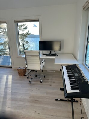 Relax and be productive in this amazing office w/ L-shaped standing/sitting desk