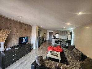 Coin salon avec écran plat , fibre optique haut débit et IPTV