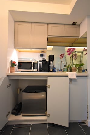 Well stocked cabinets and fridge/freezer