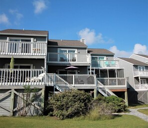 The property has 3 decks allowing everyone a spot in the sun!  The boardwalk to the beach can be accessed from the large deck off the living area.