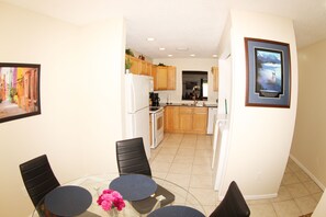 kitchen. to the right you can see the washer and dryer