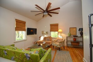 Living room with vaulted ceiling, new paint.TV connects to wifi for streaming