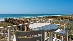 Watch the waves while relaxing on the balcony