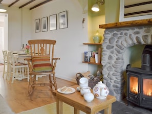 Charming living/ dining room with wood burner | Bryn Heulog, Penclawdd, near Swansea