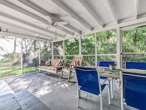 Screened Porch with Swing and Dining Table