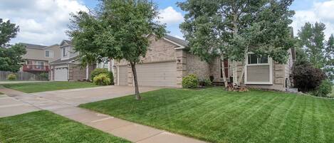 Front of home with parking on driveway.