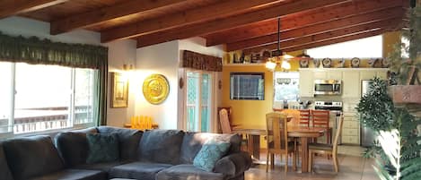 Beautiful wood beam ceiling in the open concept living room, dining & kitchen