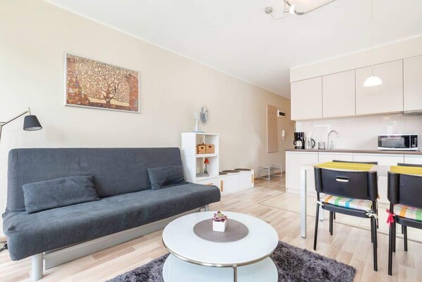 Living room with a comfortable sofa and TV. 