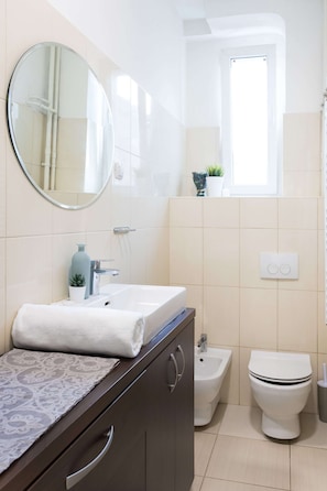 The modern bathroom is equipped with hotel-like amenities for your convenience!
