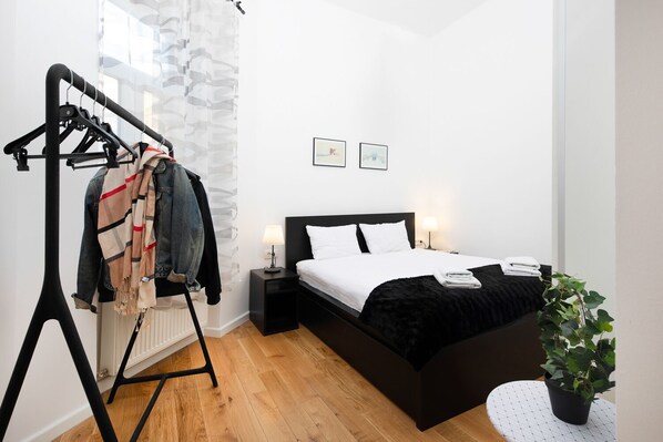 Our bright and spacious bedroom comes with fresh linen and a lot of storage space :)